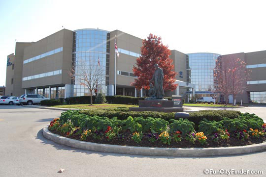 Photograph of the statue and flowers at St. Vincents hospital in Carmel, Indiana