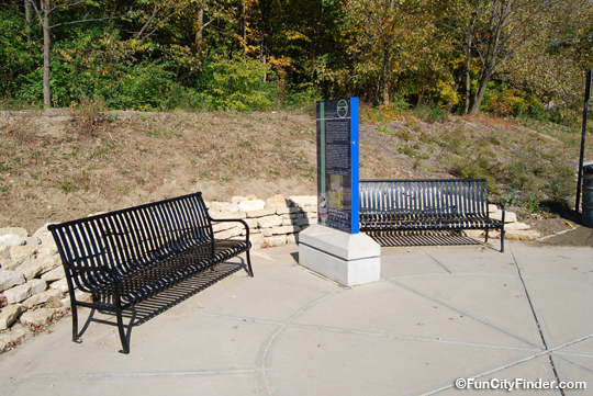Photo of benches and information about the Skiles Test park in Lawrence, Indiana